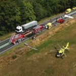 One person dies, six injured in crash between lorry and minibus