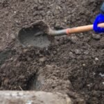 Two men suspected of helping grave robber sell stolen valuables