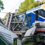 Passengers evacuated after train hits lorry on level crossing