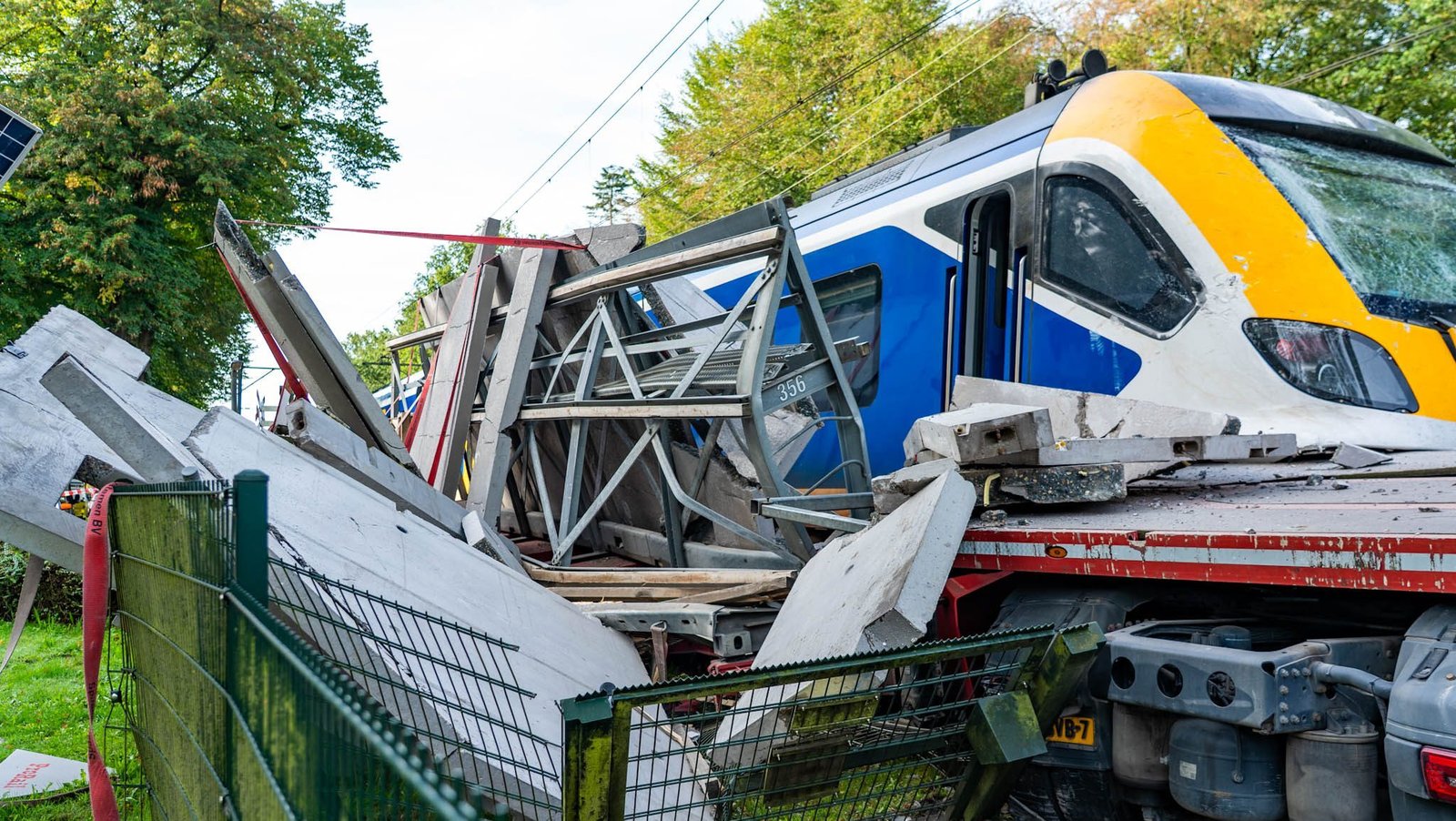 Passengers evacuated after train hits lorry on level crossing