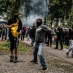 Arrests after far-right protesters attack police in The Hague